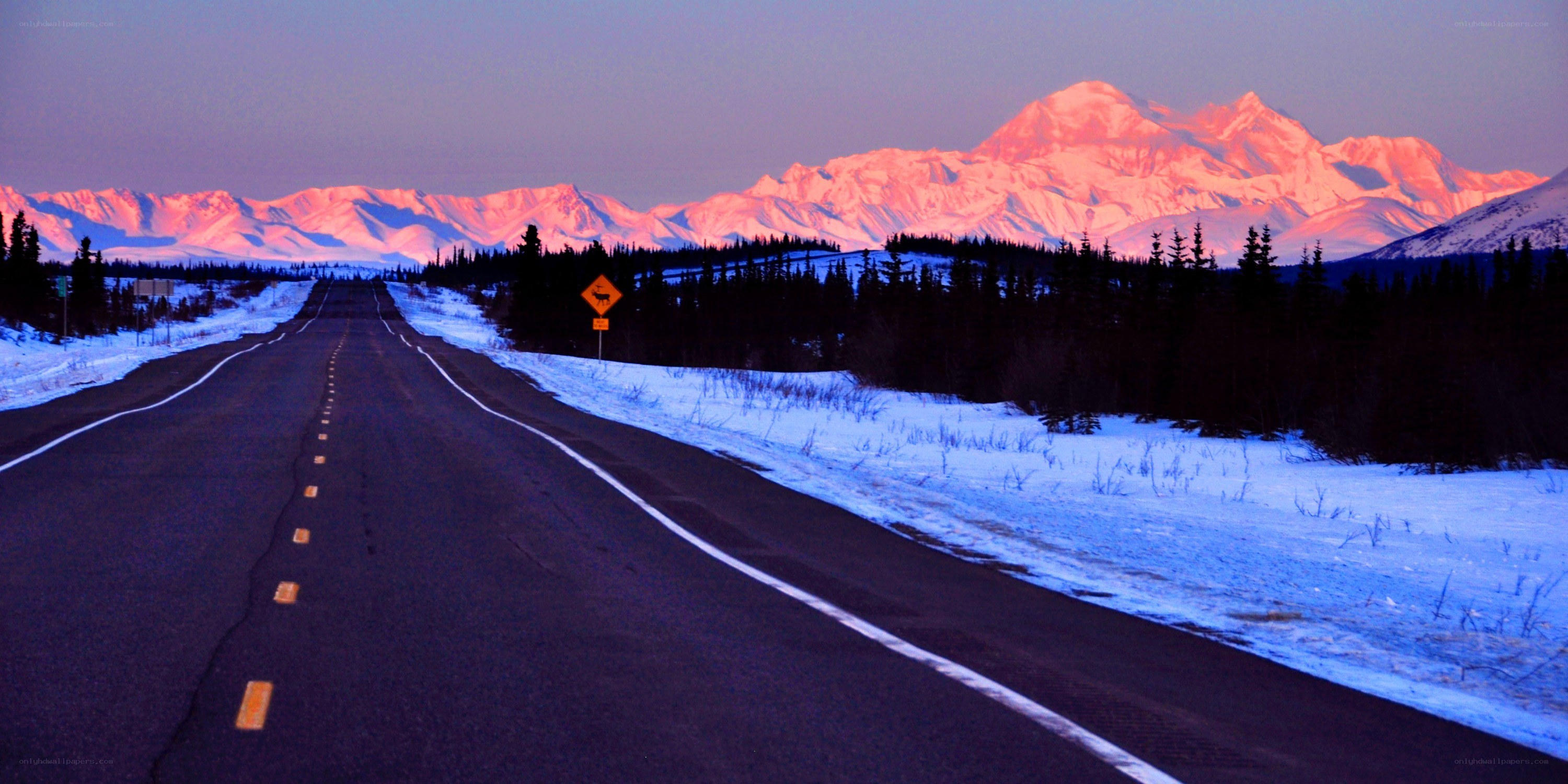 Road to a mountain at sunset