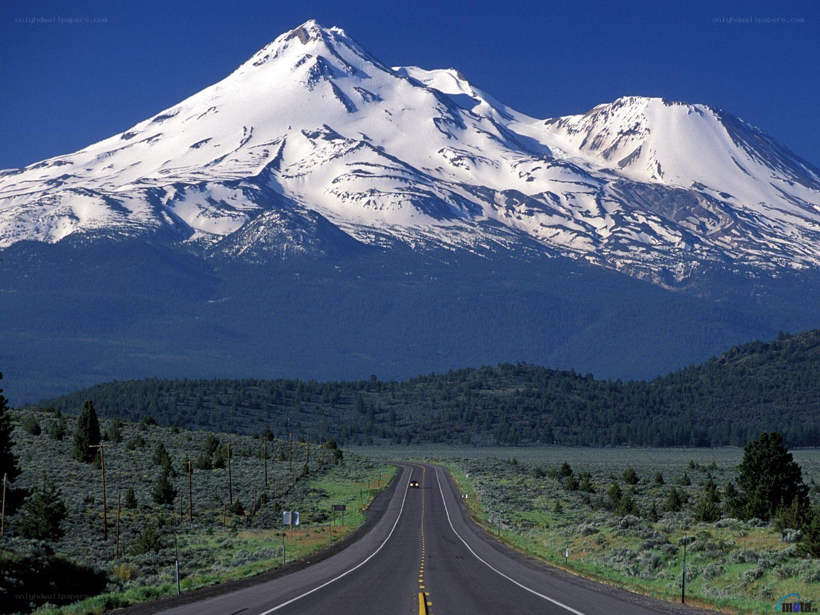 Road to a snow-capped mountain