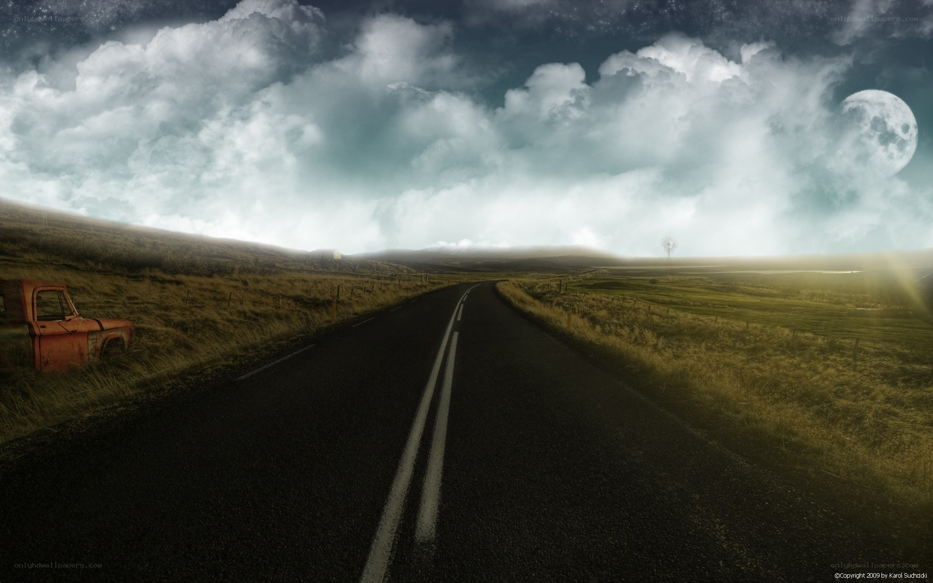 Road under a moonlit sky