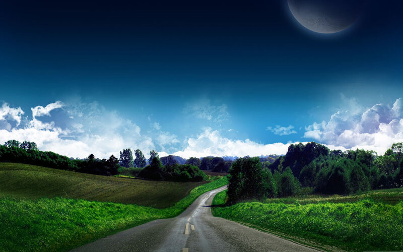 Road under a moonlit sky