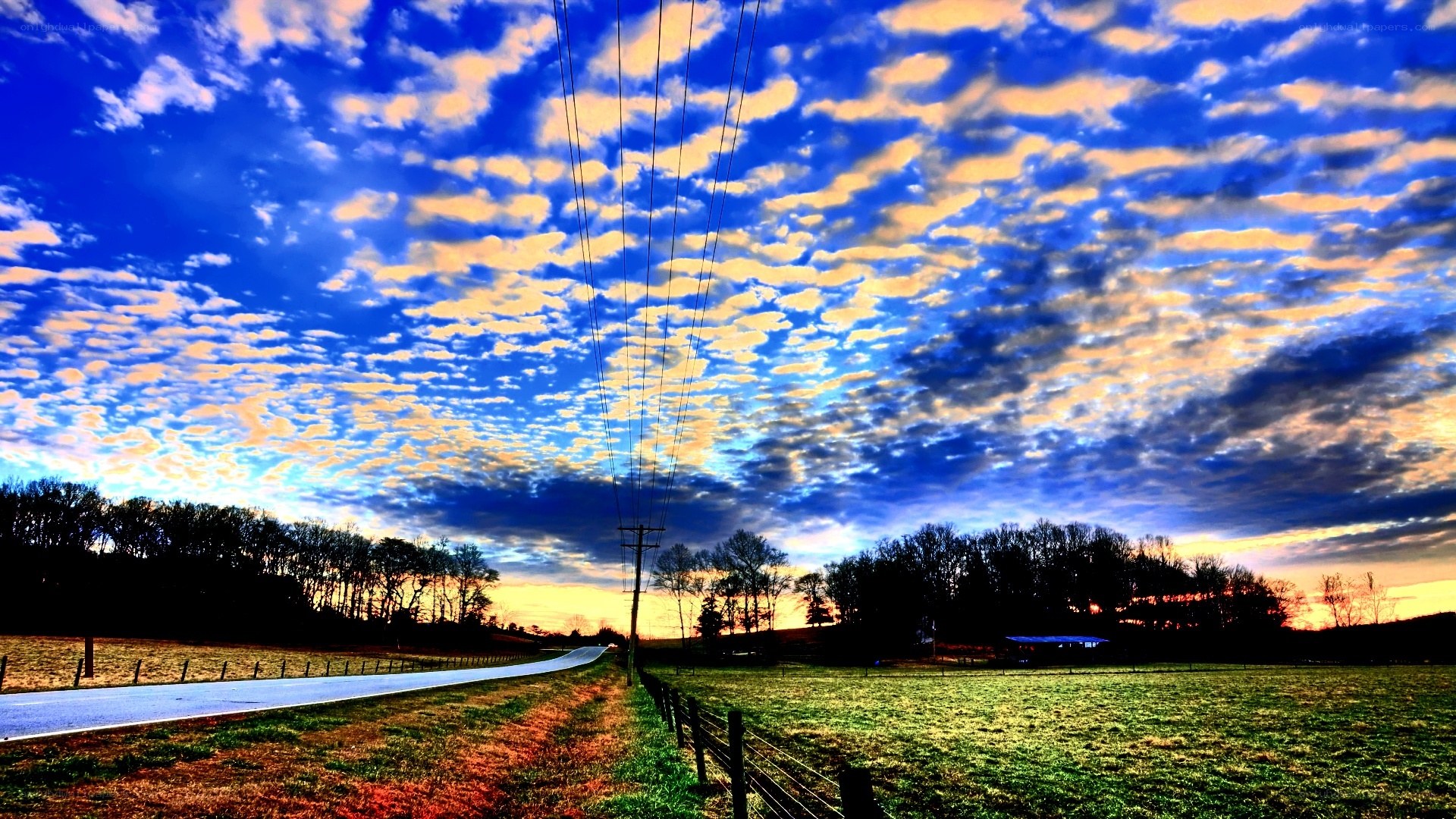 Road under dramatic sky at sunset