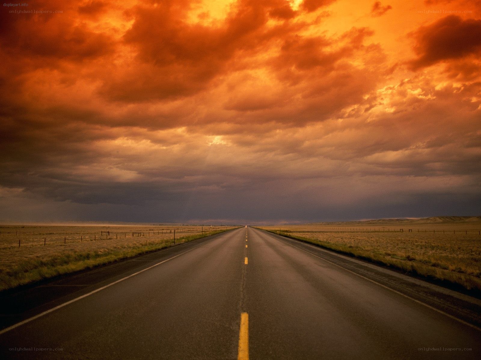 Road under stormy sky