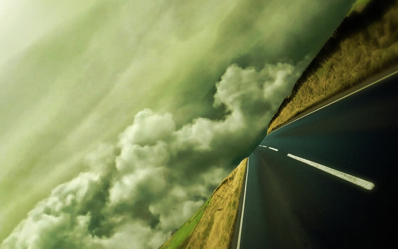 Road under stormy sky