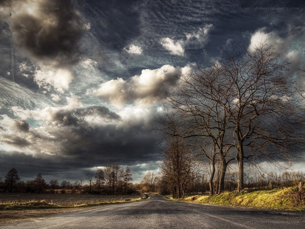 Road under stormy sky