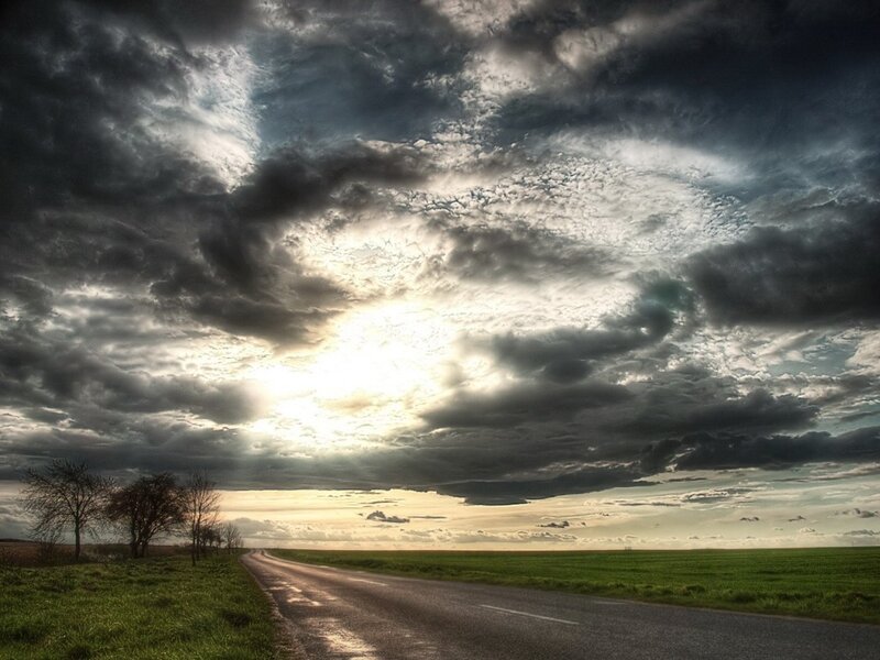 Road under stormy sky