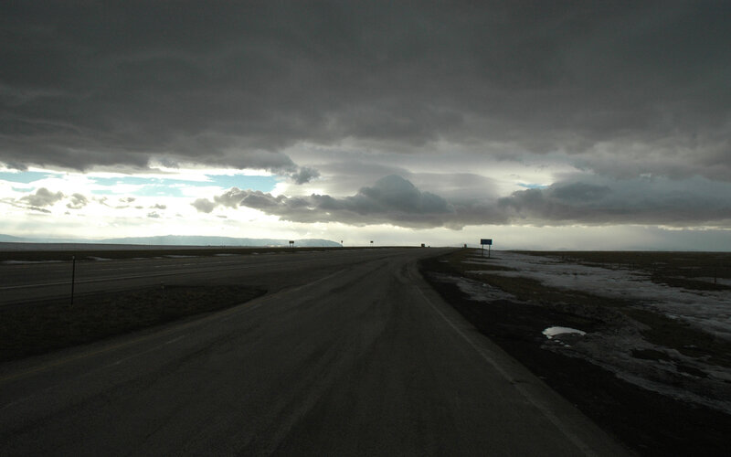Road under stormy sky