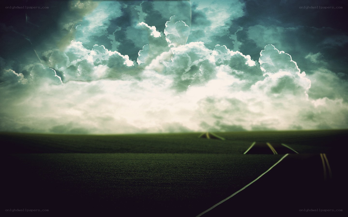 Road under stormy sky