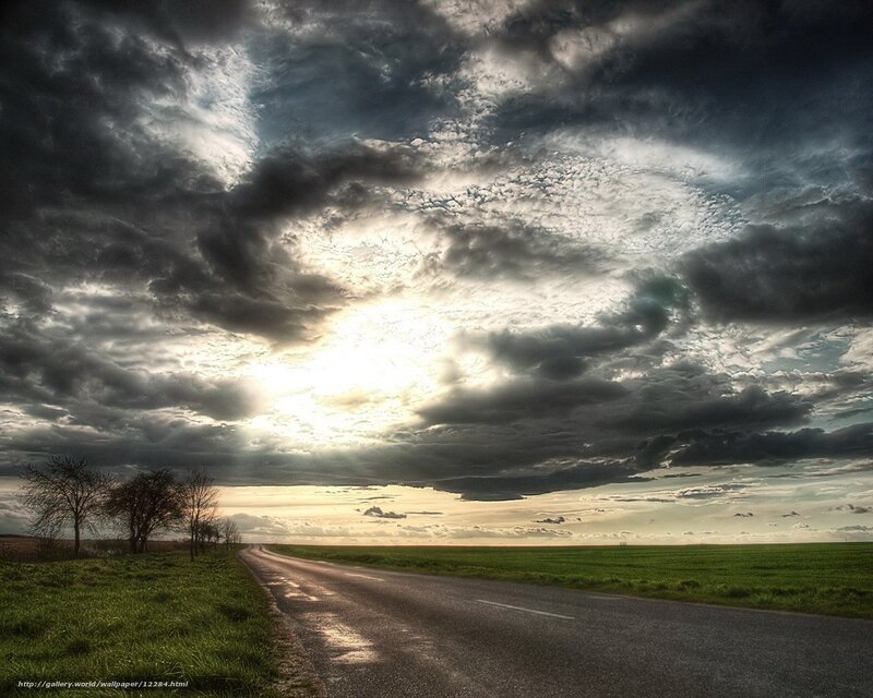Road under stormy sky
