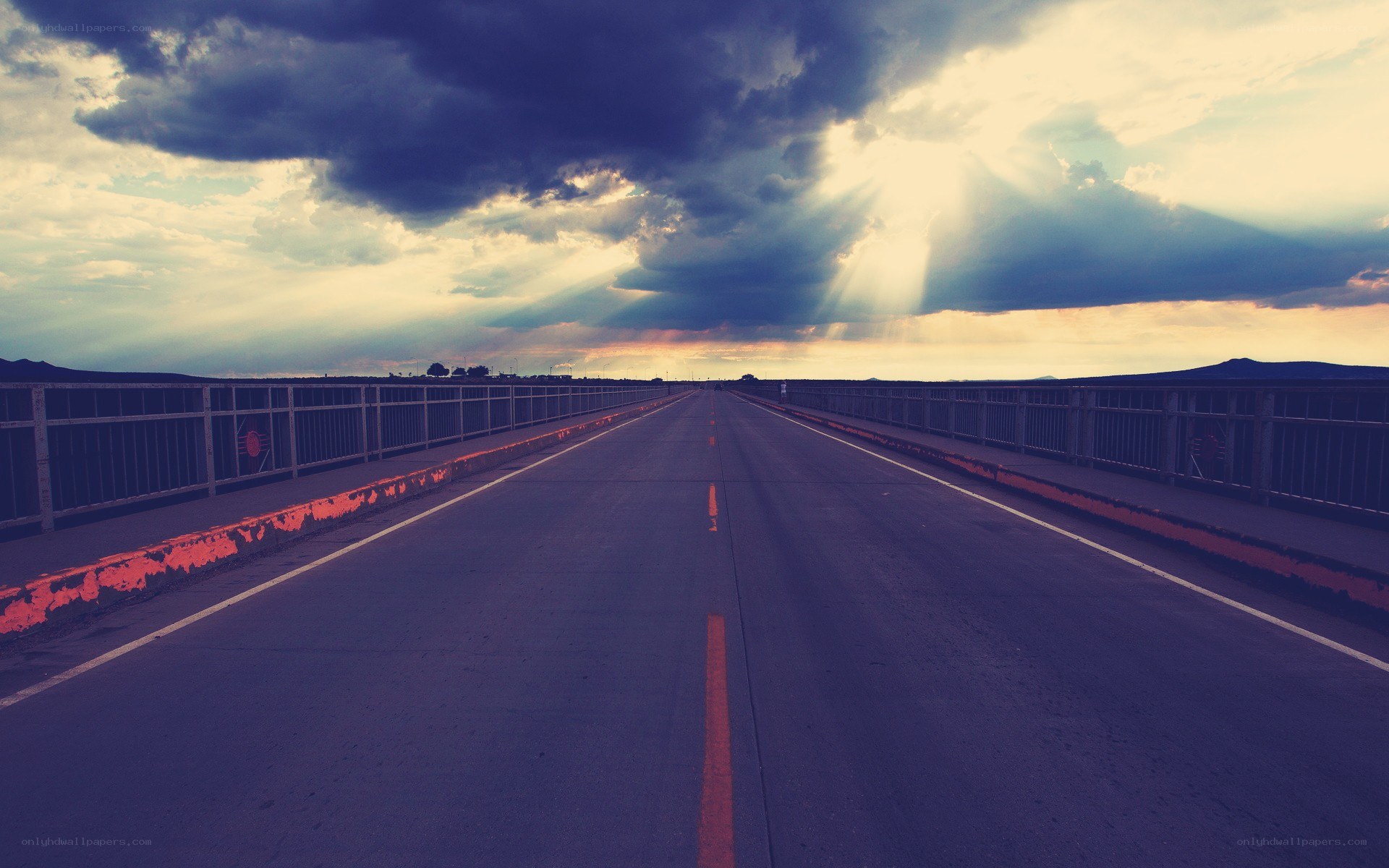 Road under stormy sky
