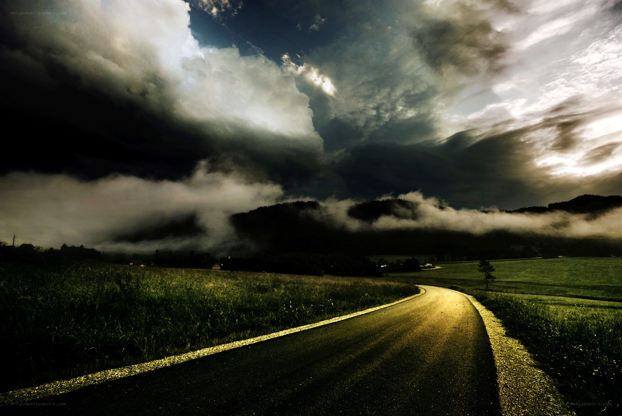 Road under stormy sky