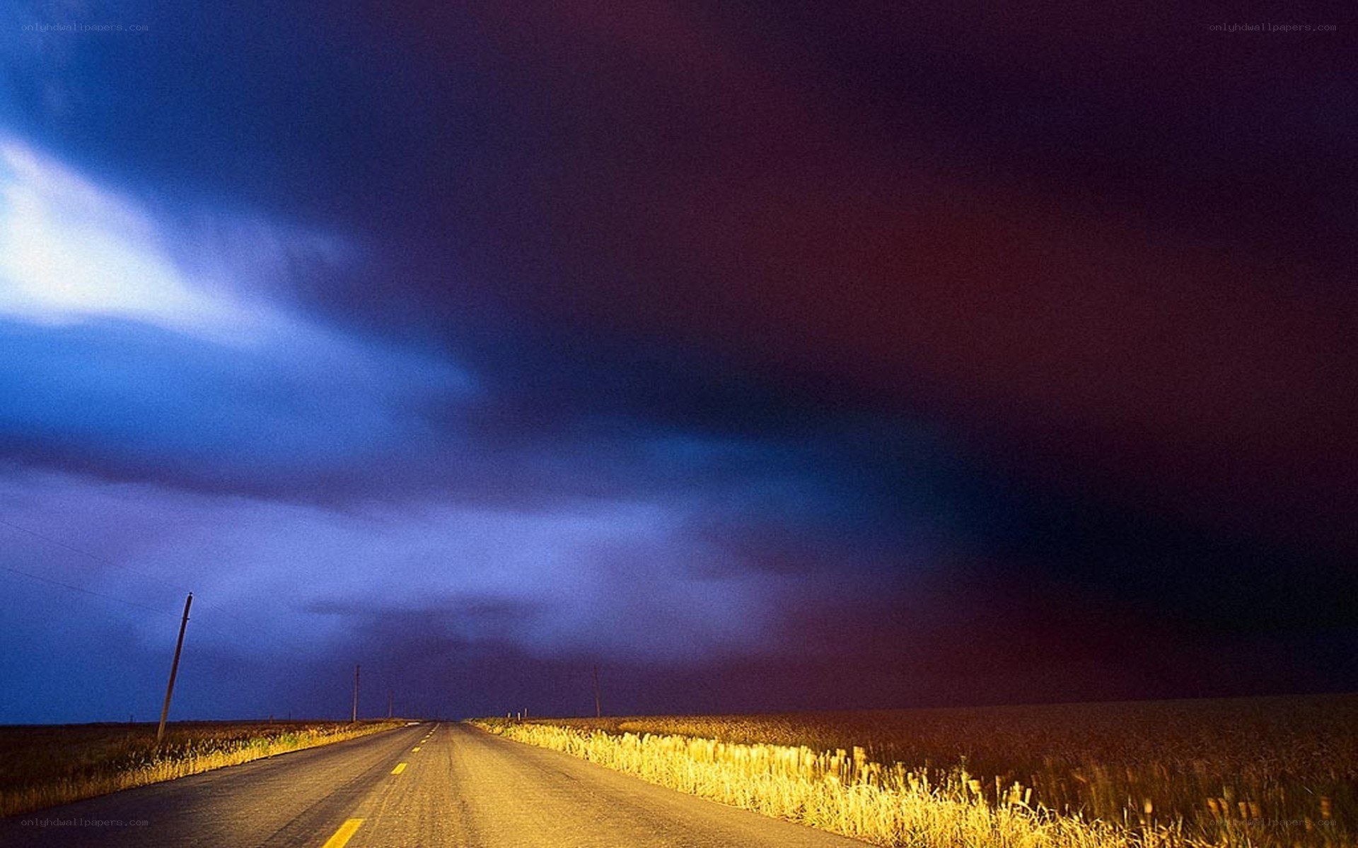 Road under stormy sky