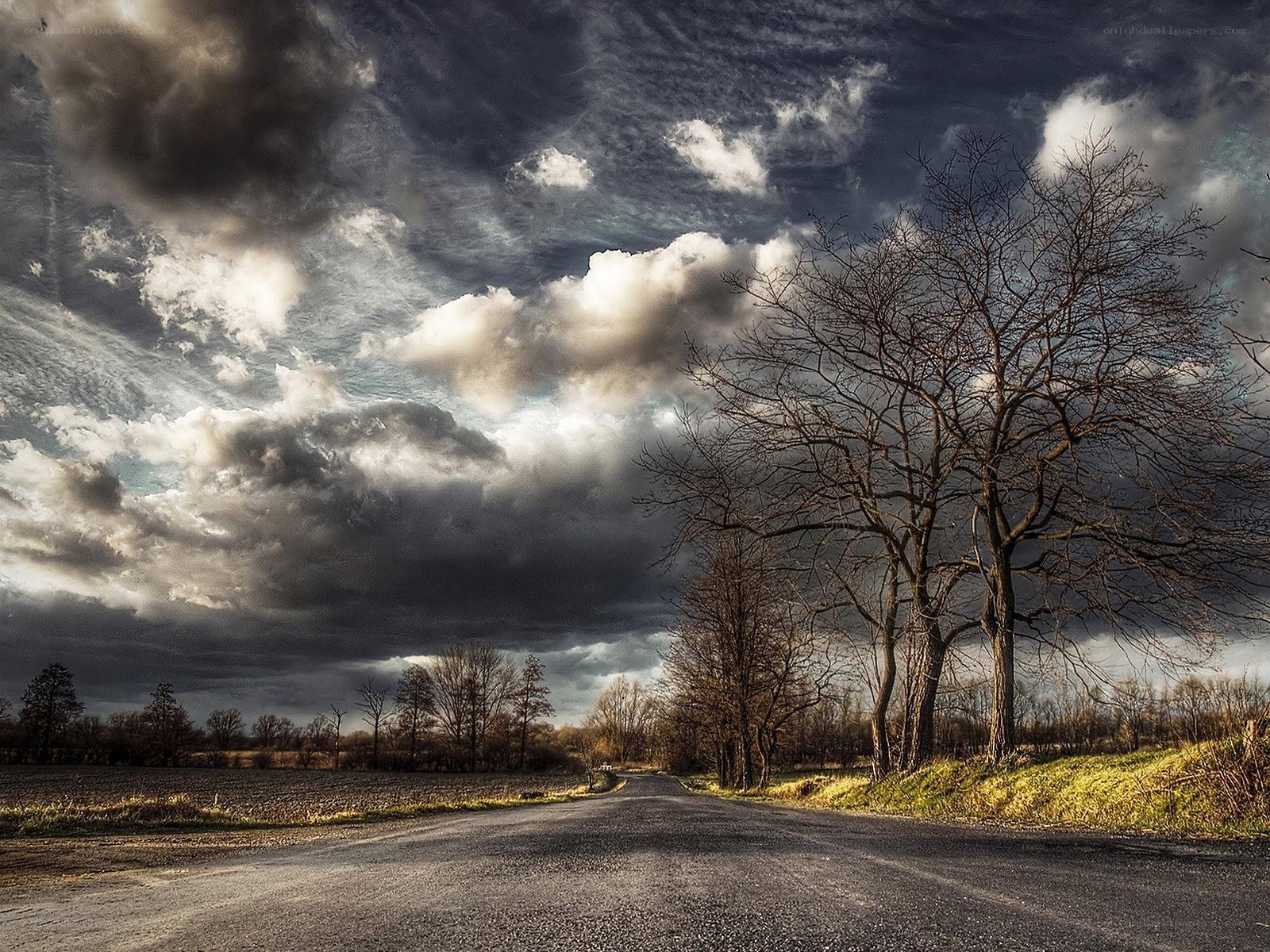 Road under stormy sky