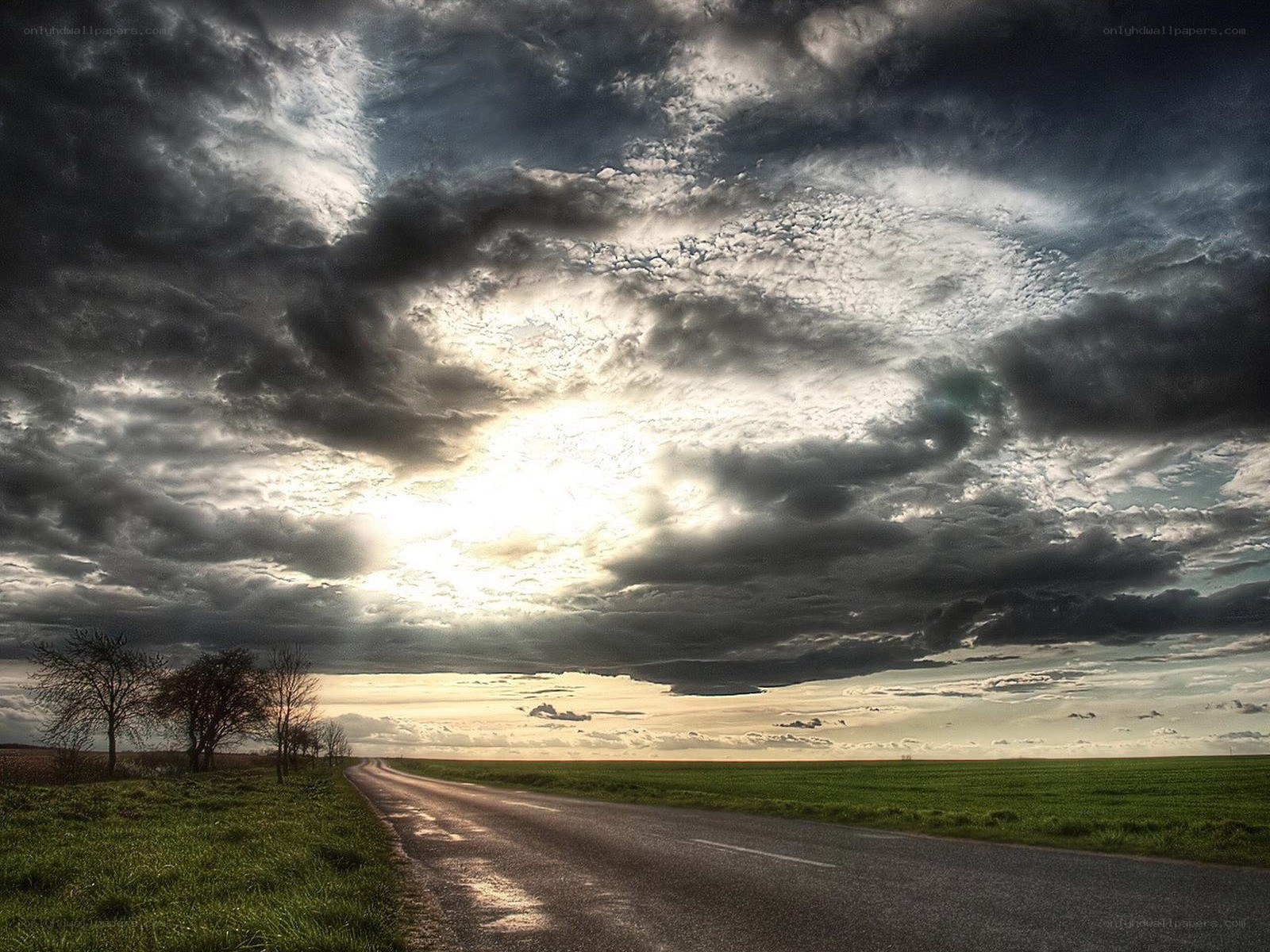Road under stormy sky