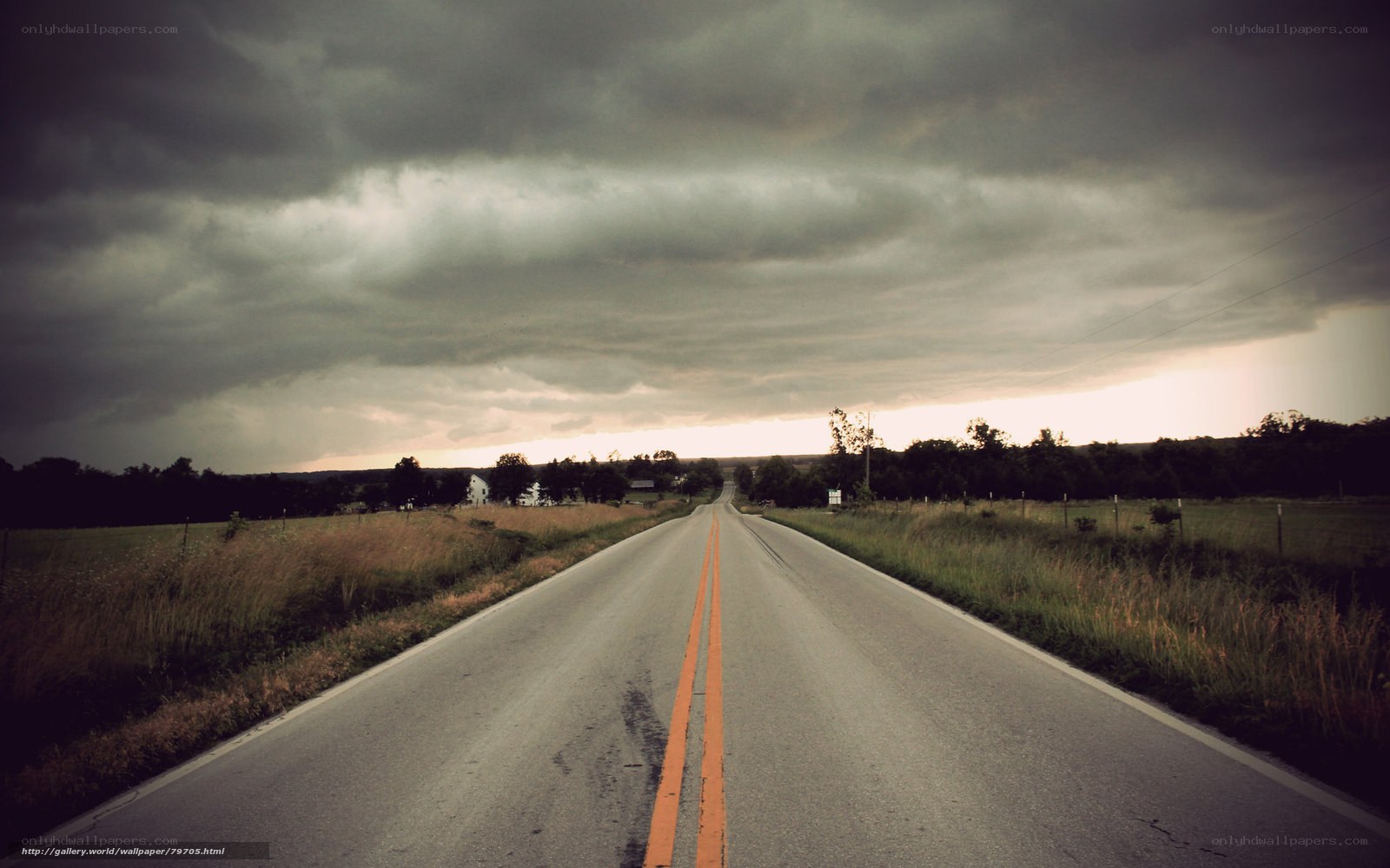 Road under stormy sky