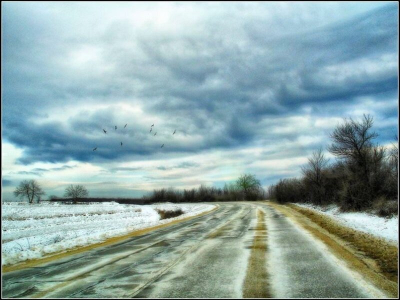 Road under stormy sky