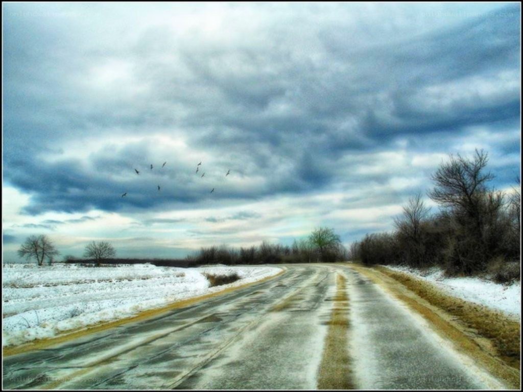Road under stormy sky