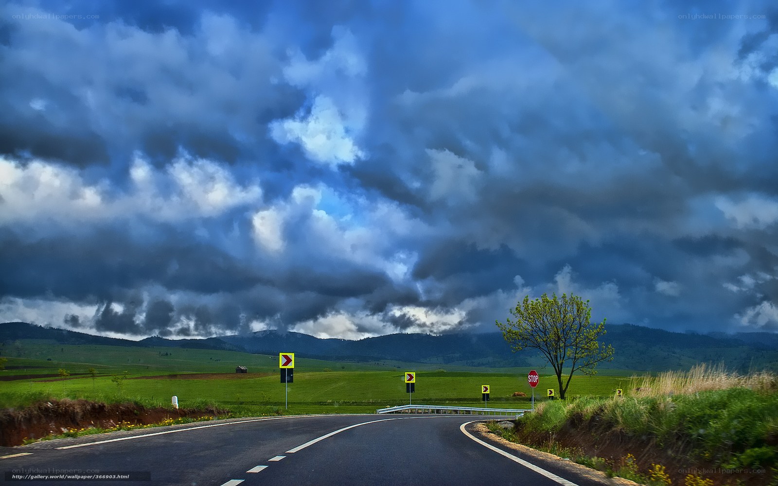 Road under stormy sky