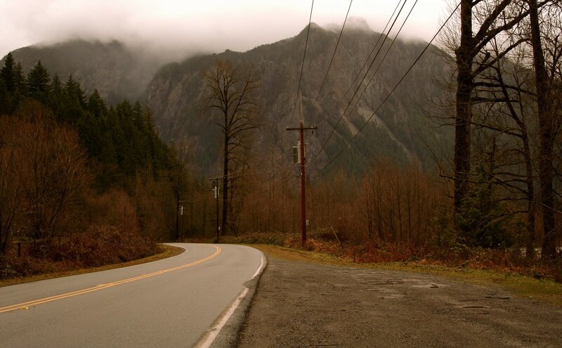 Road winding through mountain forest