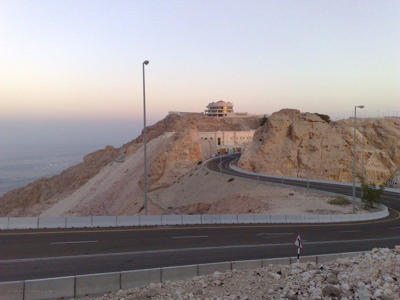 Road winding up a rocky hill
