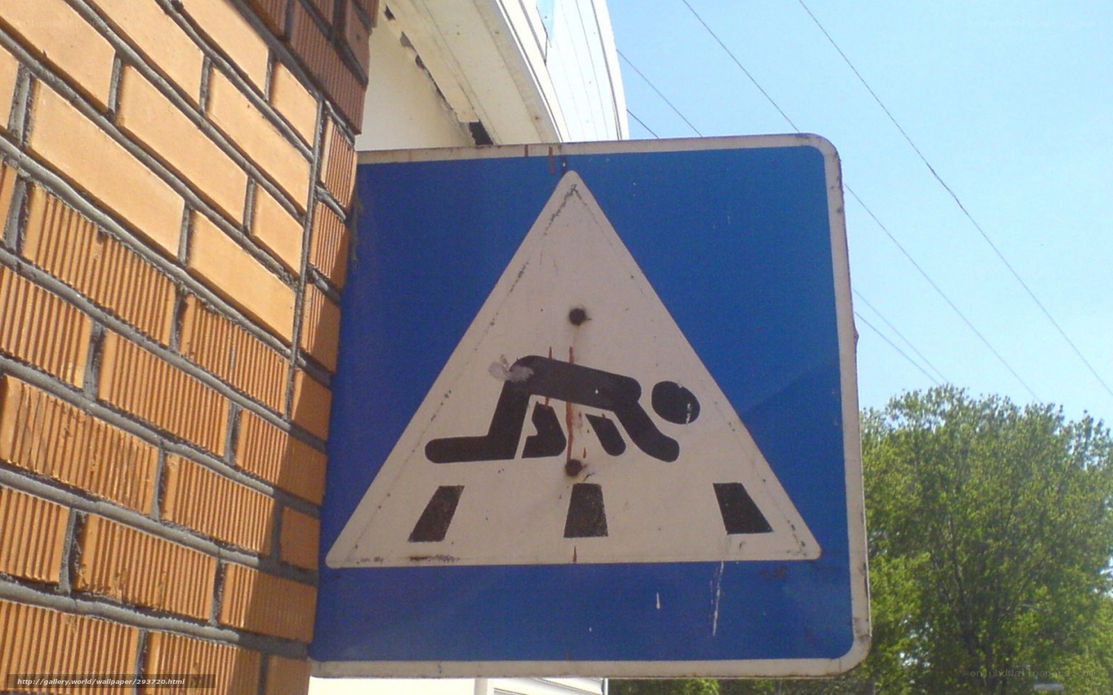 Road work sign on brick wall