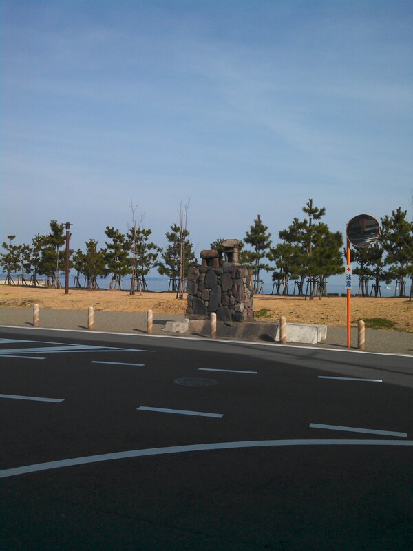 Roadside stone monument near beach