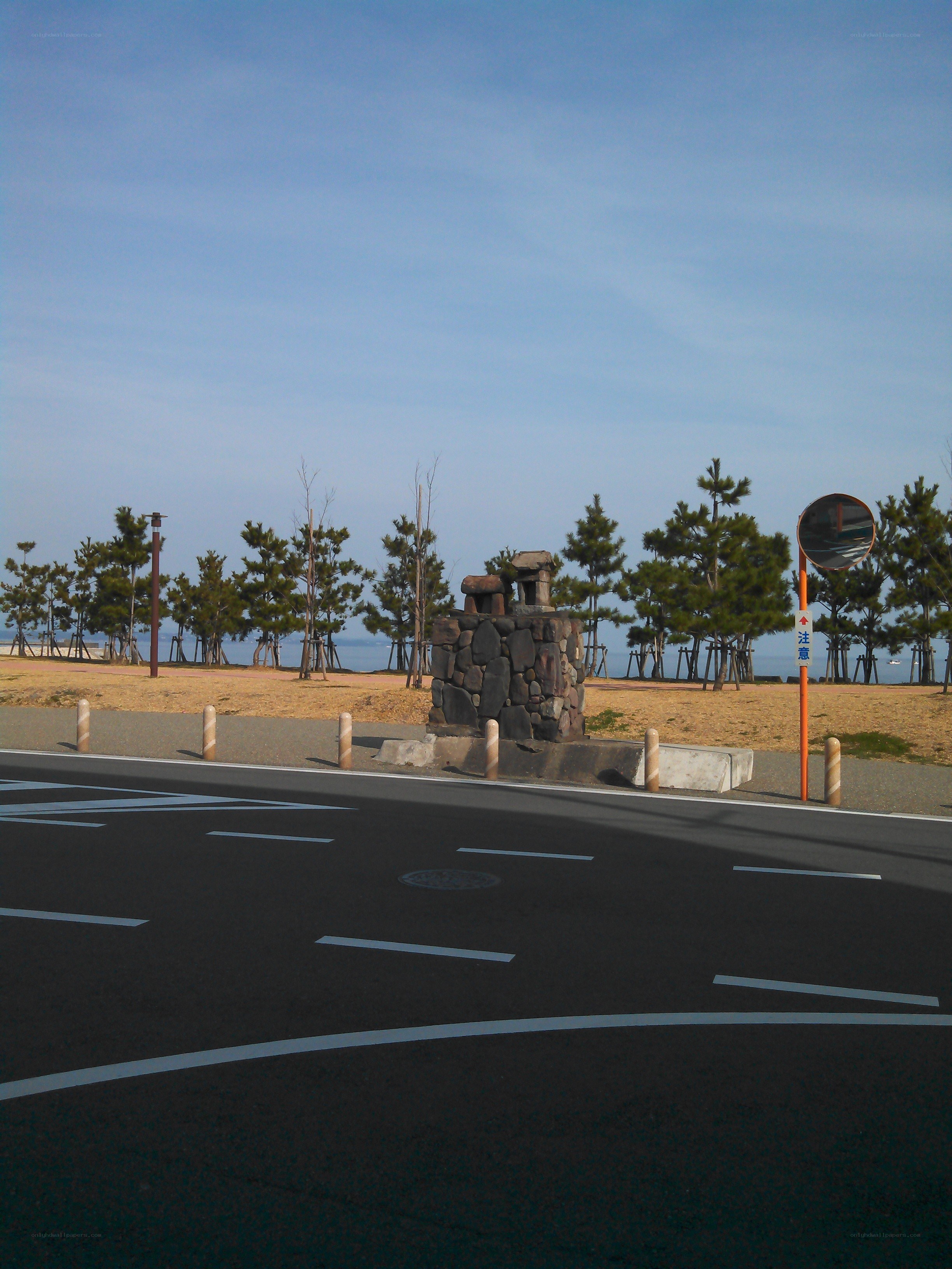 Roadside stone monument near beach