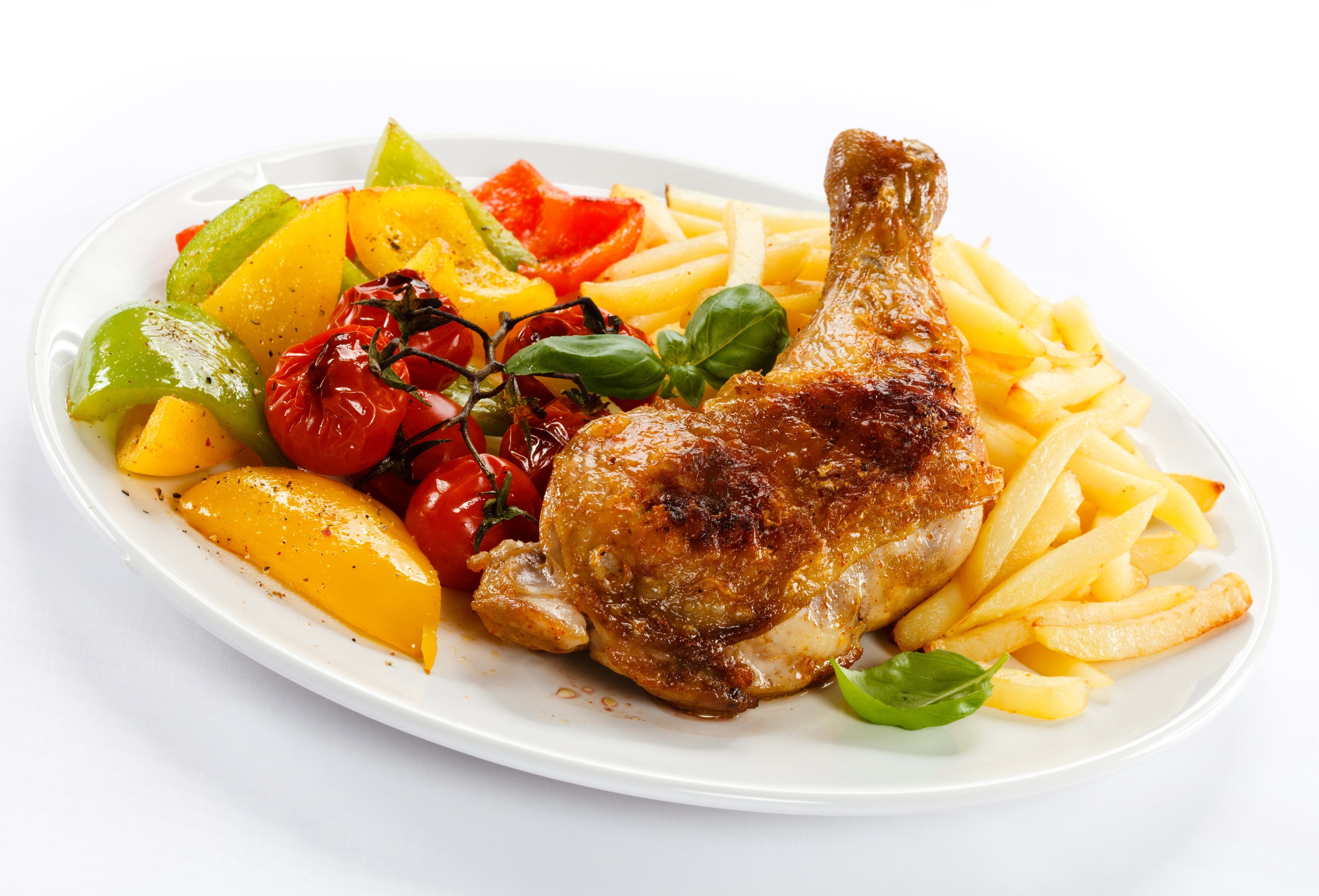 Roasted chicken with fries and vegetables