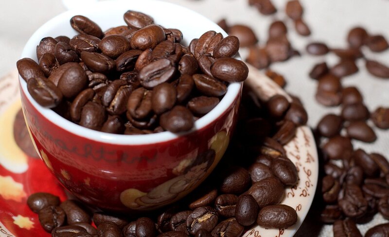 Roasted coffee beans in a cup