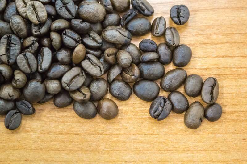 roasted coffee beans on wood