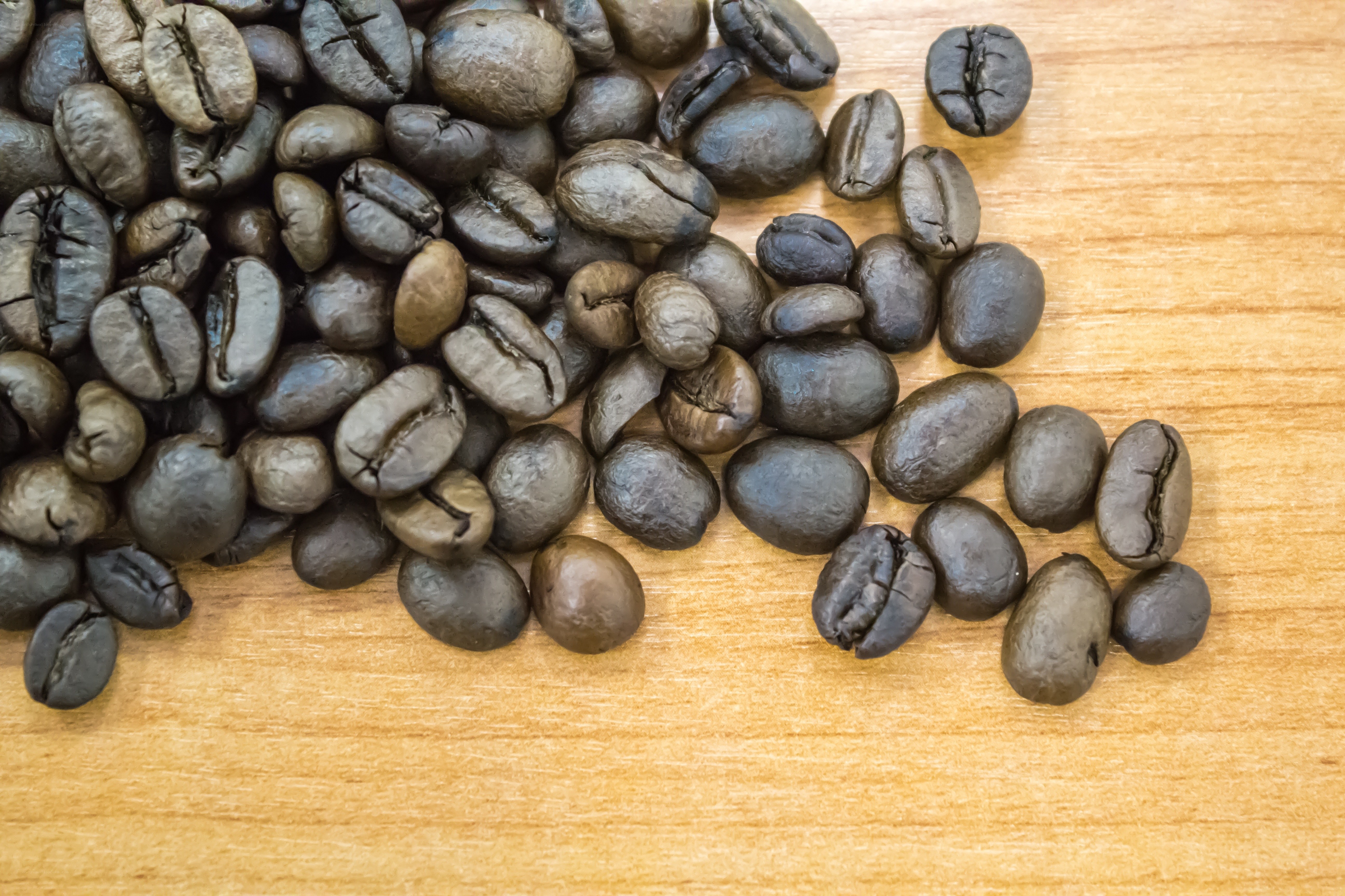 roasted coffee beans on wood