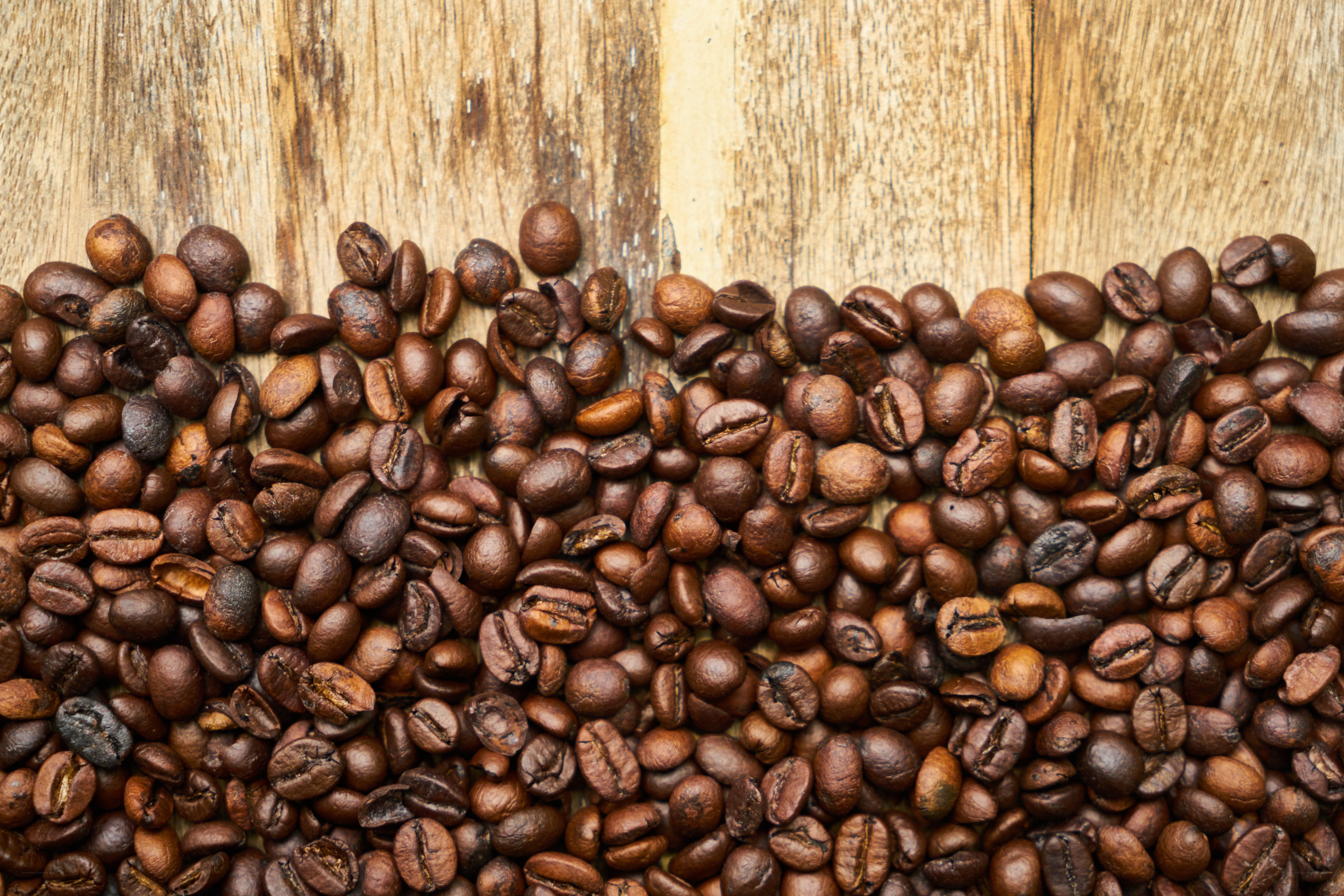 roasted coffee beans on wood