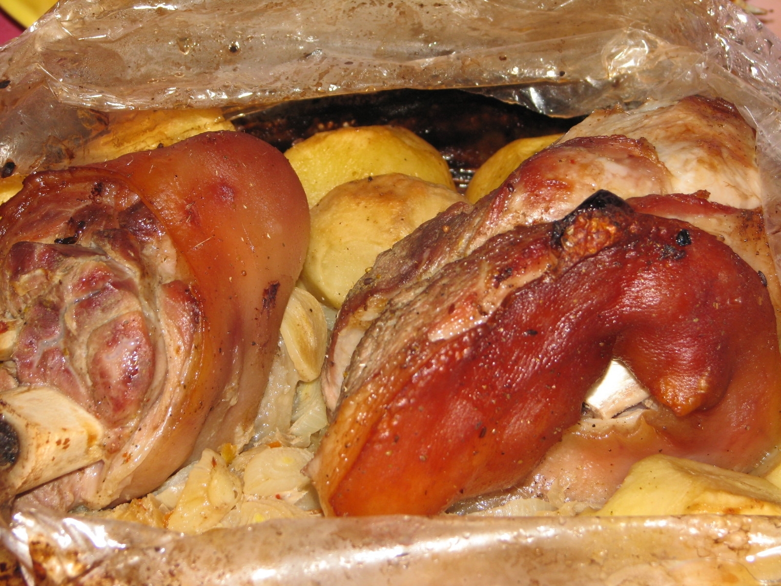 Roasted pork legs with potatoes