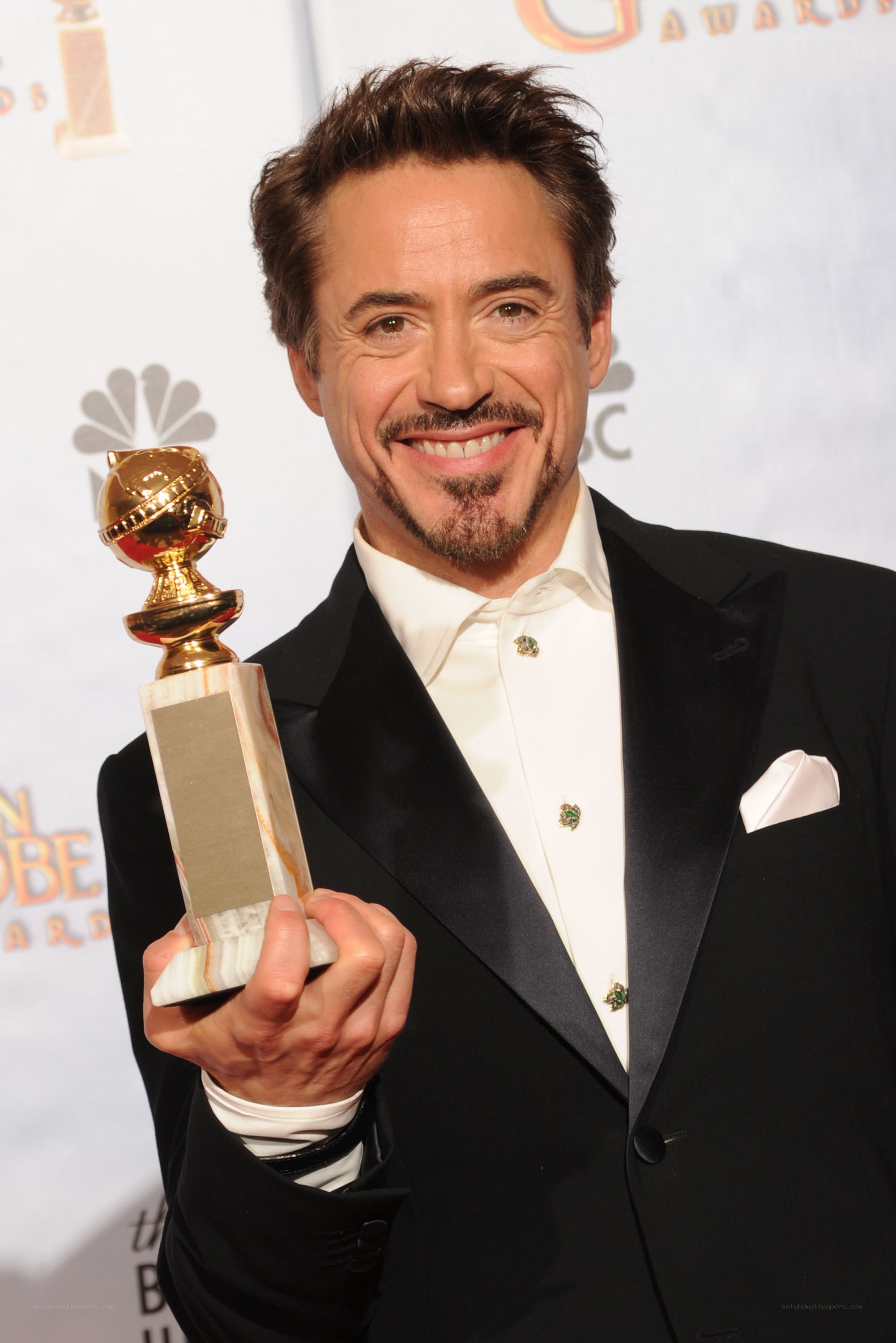Robert Downey Jr. holding Golden Globe