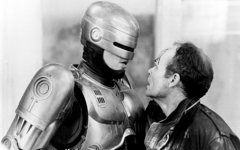 RoboCop confronts a man
