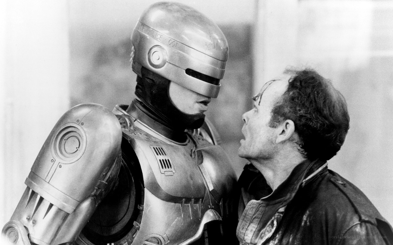 RoboCop confronts a man