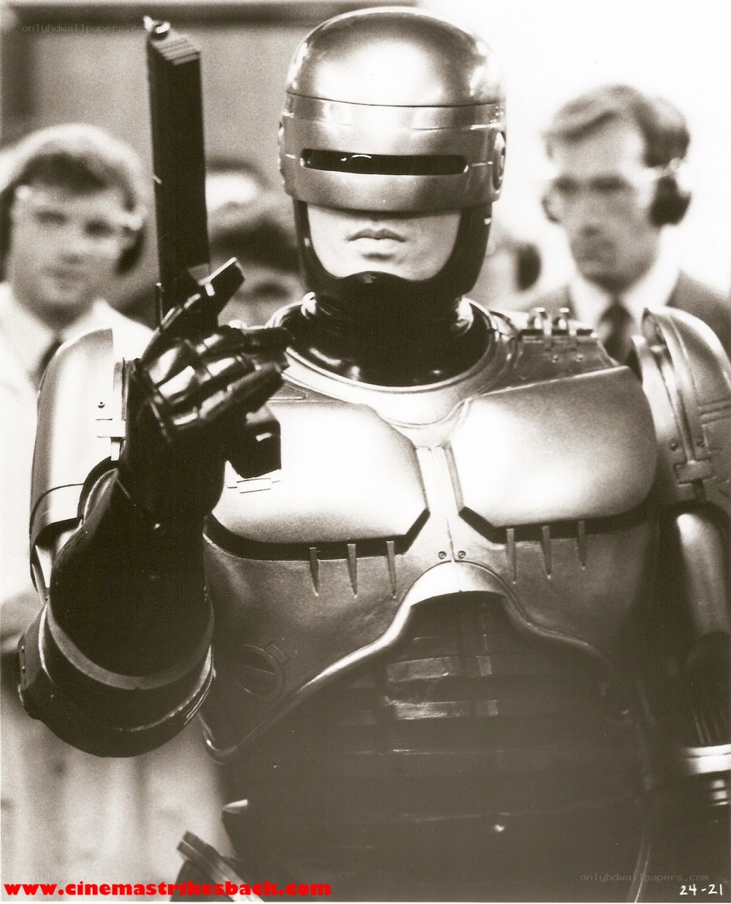 RoboCop holding a gun