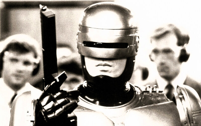 RoboCop holding a gun