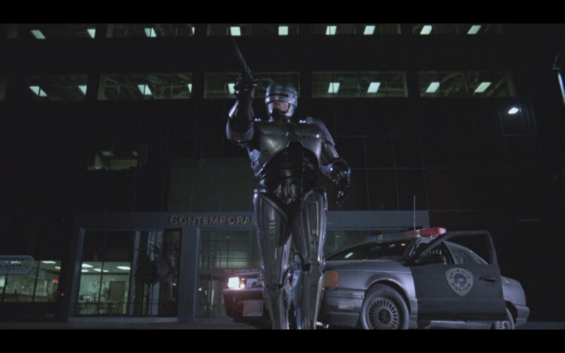RoboCop stands at night