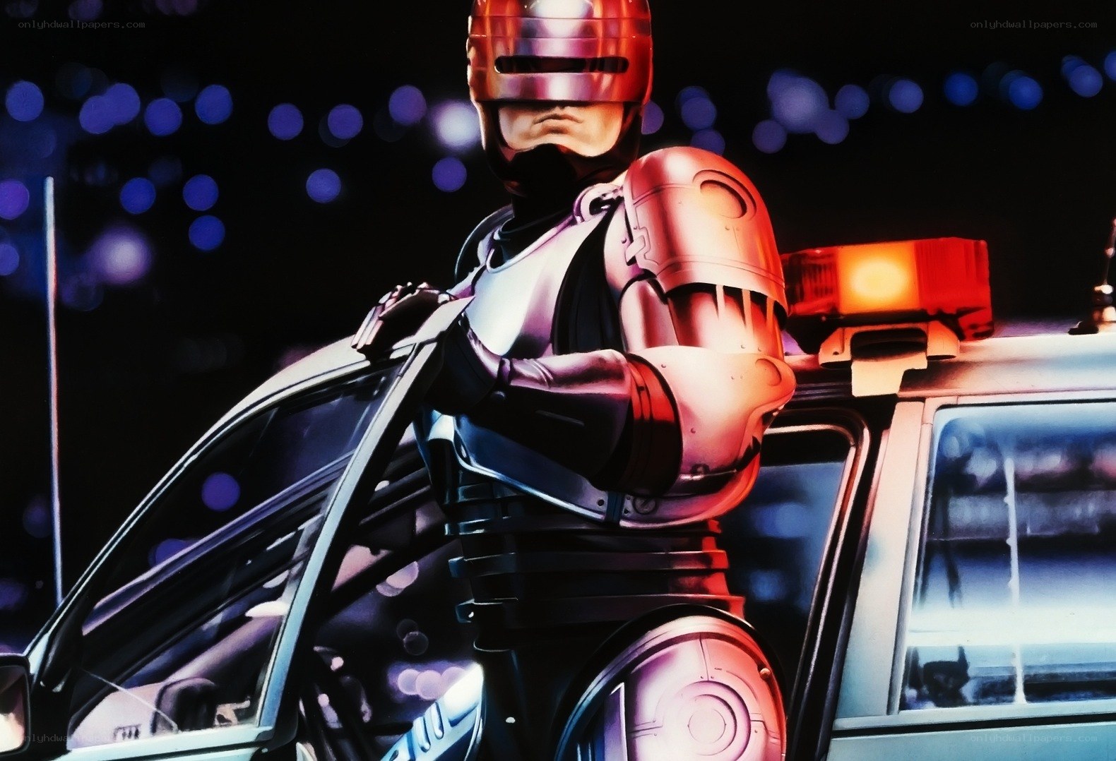 RoboCop stands by police car
