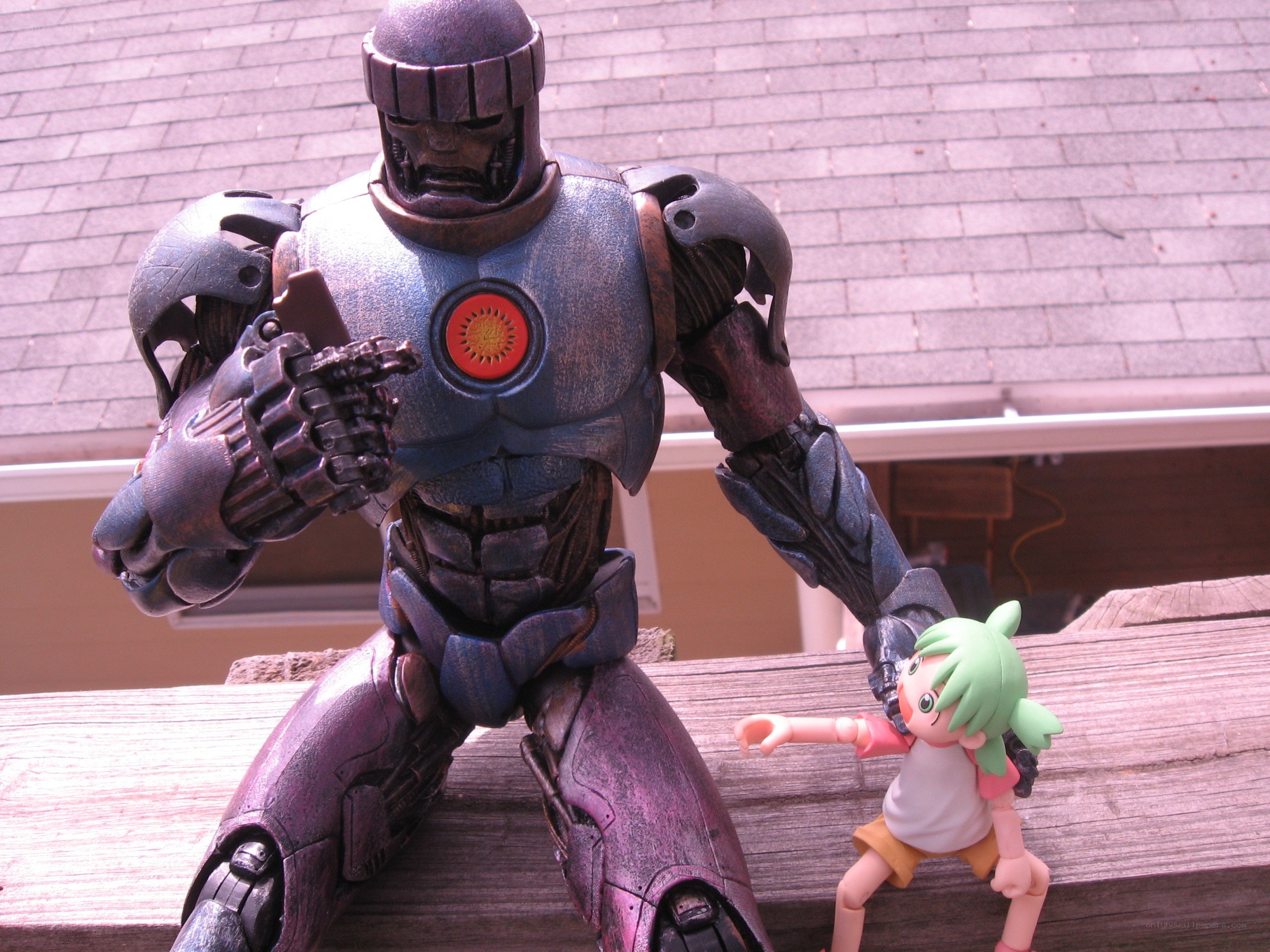 Robot and anime figure on wood