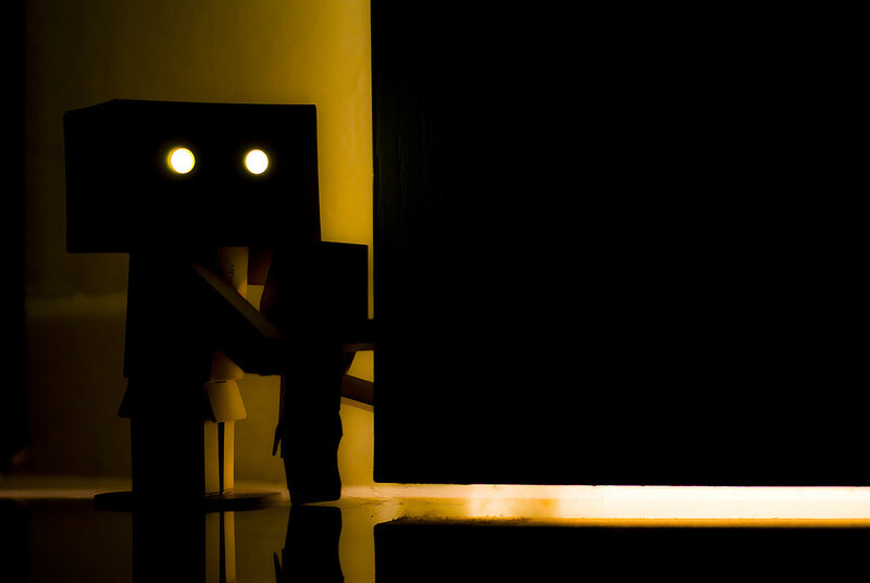 robot figure in dim light