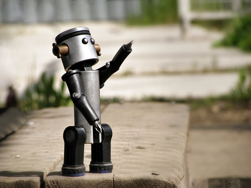 robot figurine on a bench