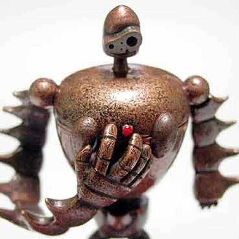 robot figurine with red gem