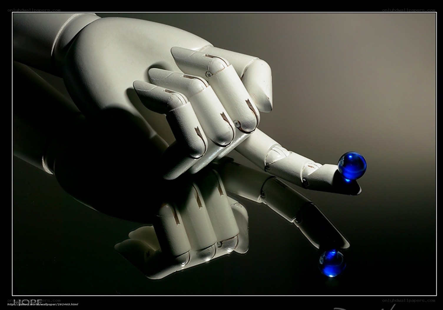 robot hand holding blue sphere