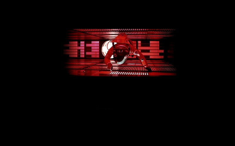 robot in red-lit chamber