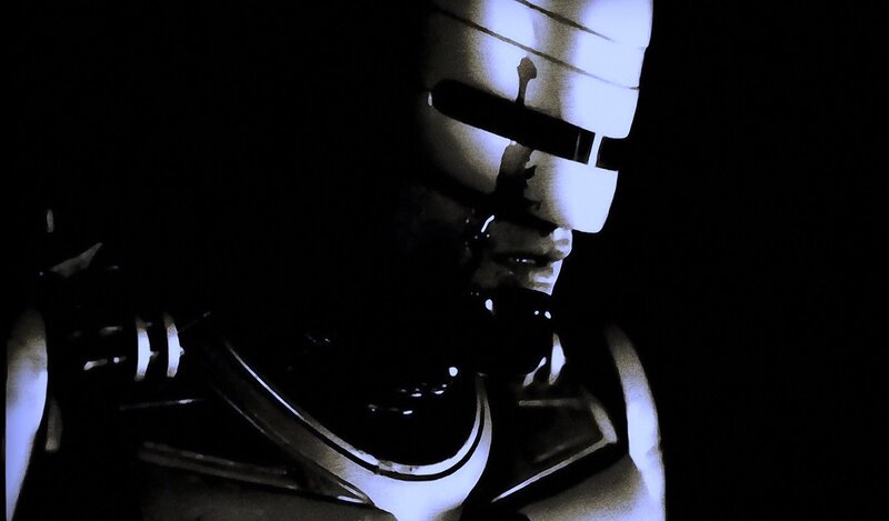 Robotic Figure in Dark