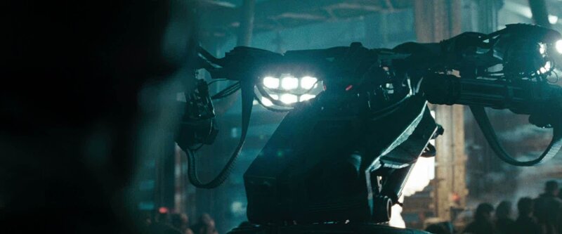 robotic weapon in dark setting