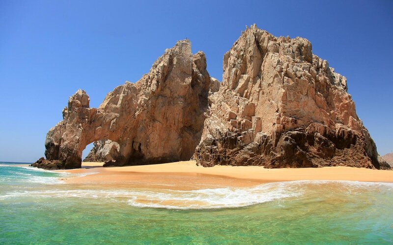 Rock Arch at Beach — Blue, Serene, Afternoon, Photograph, Sand, Ocean