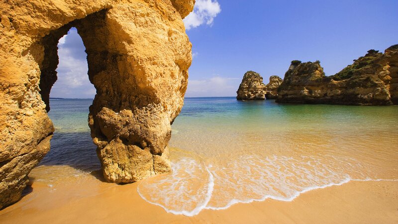 Rock Arch at Beach — Blue, Serene, Afternoon, Photograph, Sea, Sand, Cliffs
