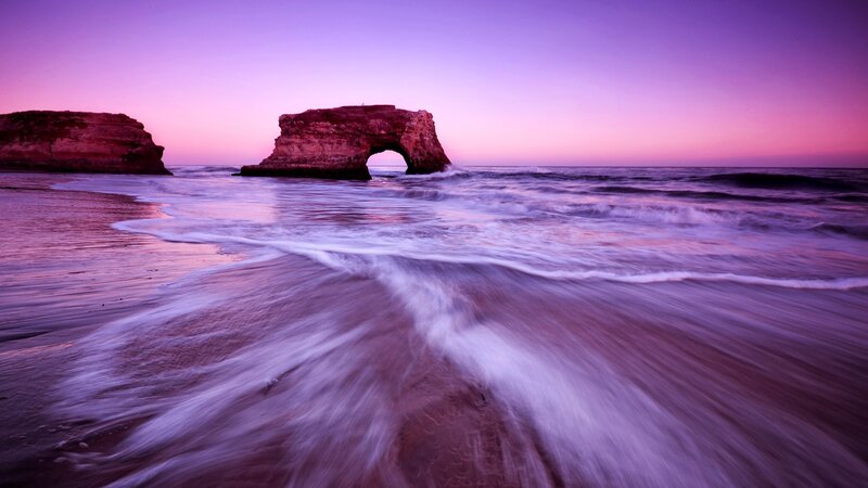 Rock Arch at Beach — Purple, Serene, Sunset, Photograph, Ocean, Sand, Sky